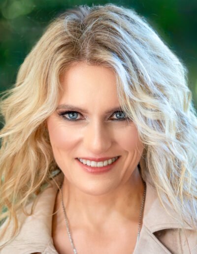 Blonde woman closeup with Green Leafy Background