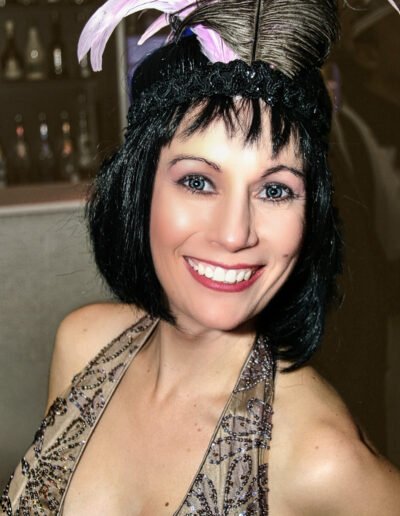 Woman at Birthday Party 20's Night dressed as 1920's Gangster Girl
